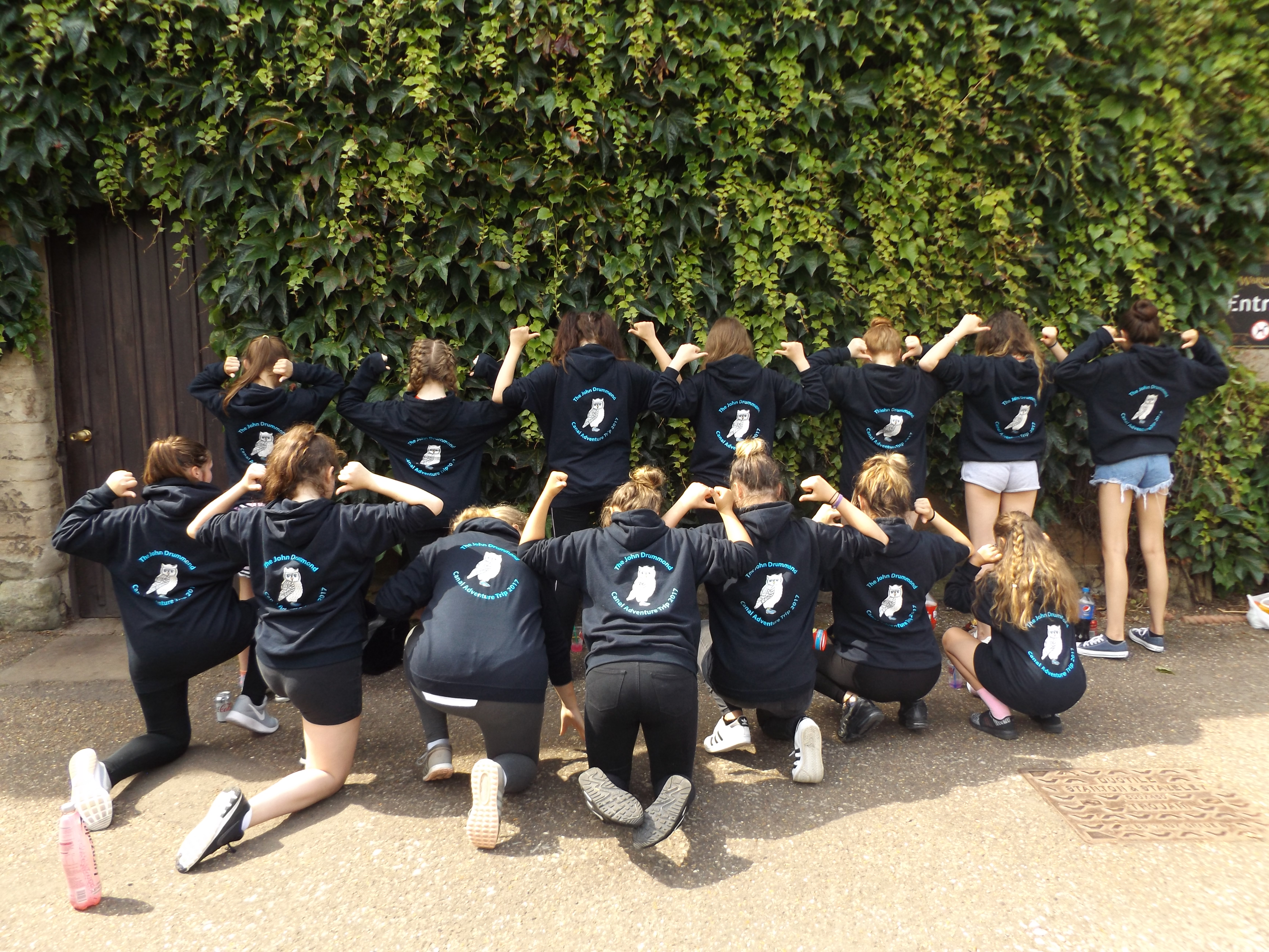 pupils at oxclose show their john drummond trust logos on their hoodies