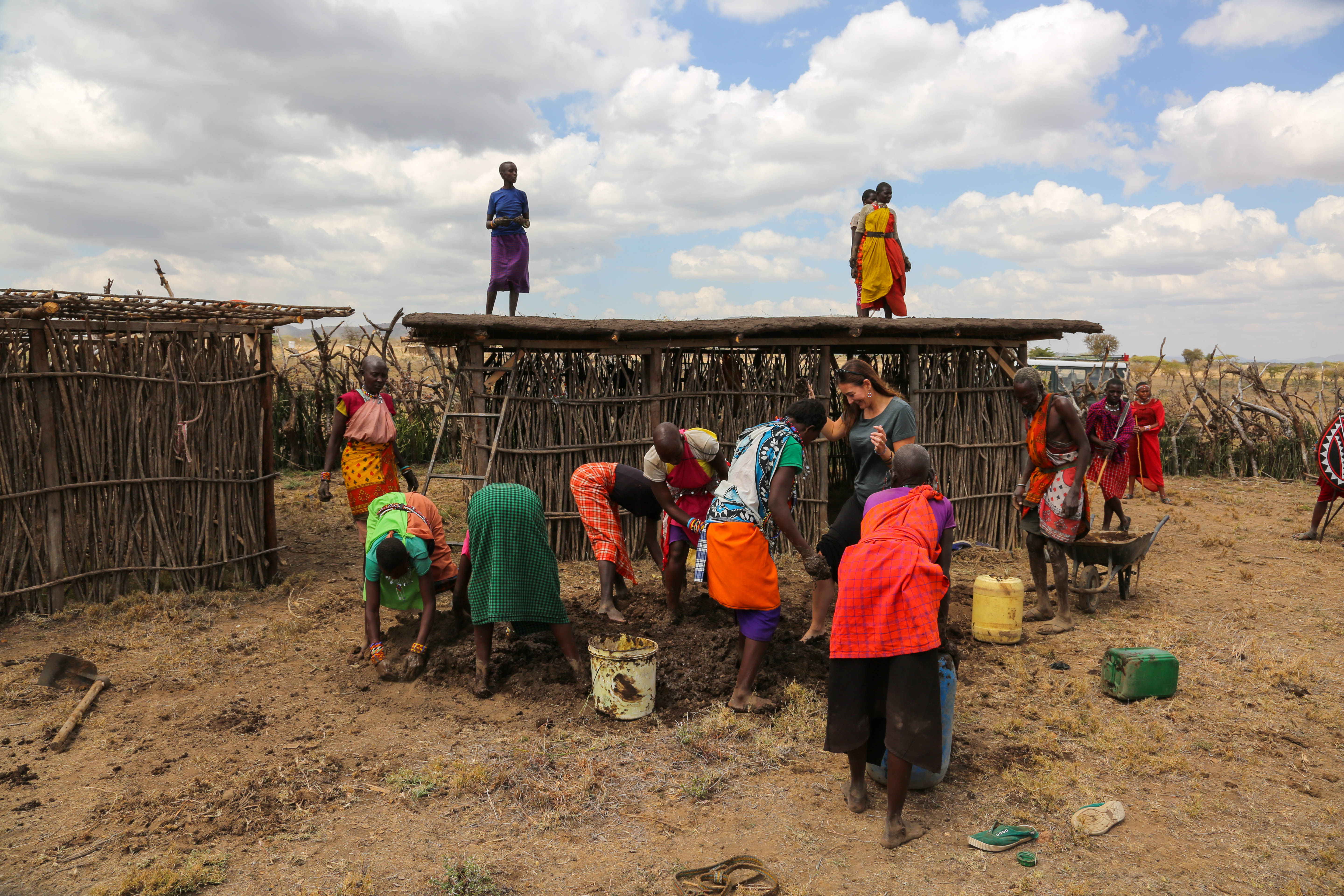 Helping to build a hut in maasai village